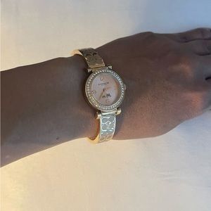 Rose gold women’s Coach watch